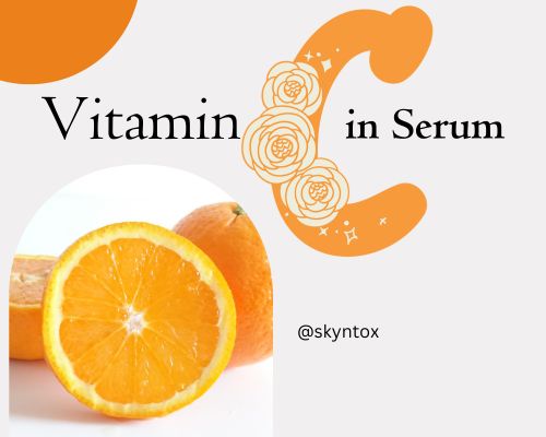 A lady using serum rich with vitamin c